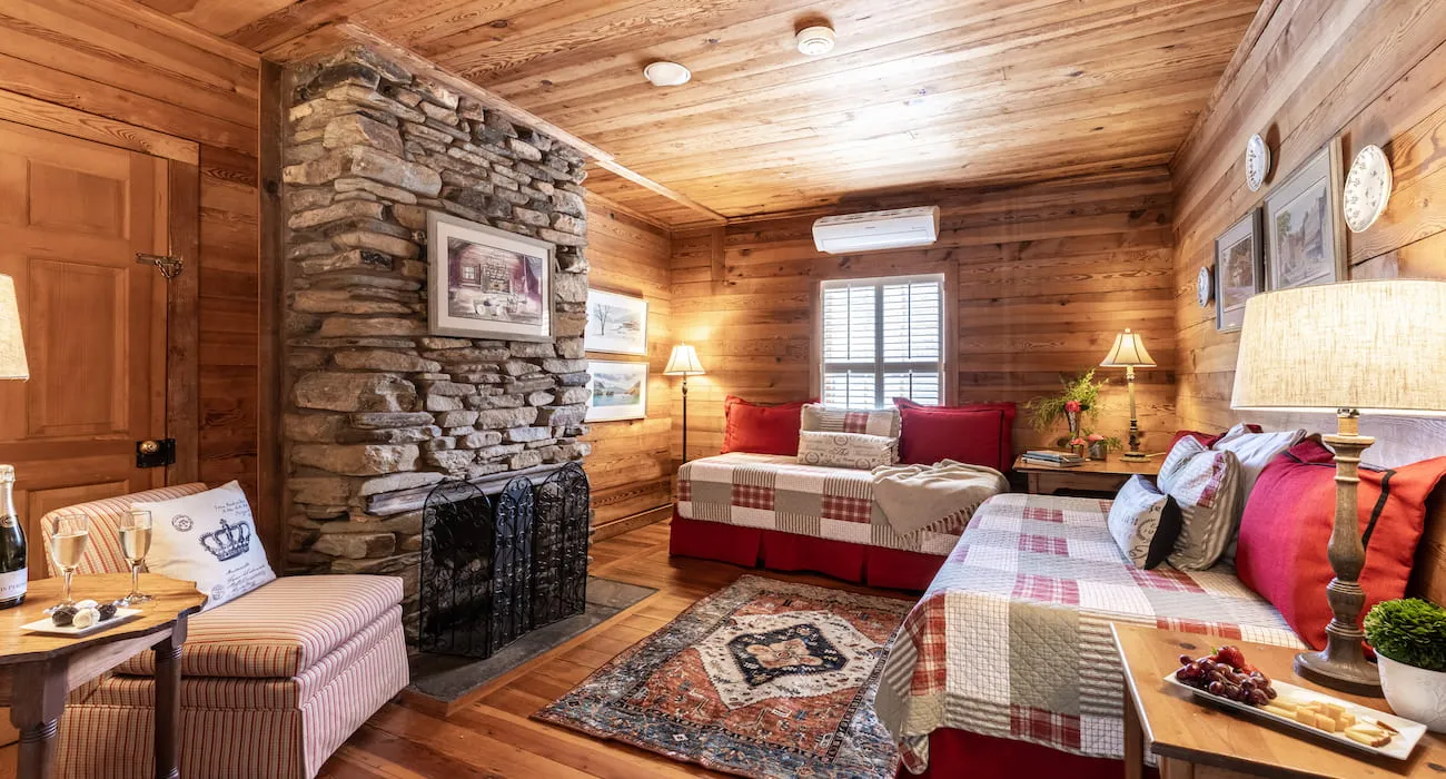 Family style guest room with stone fireplace